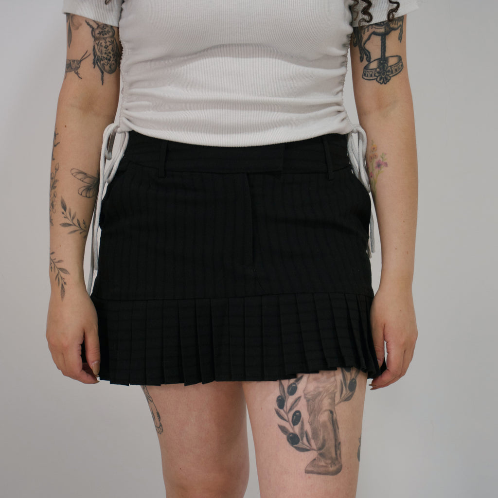 Mini falda negra preppy
