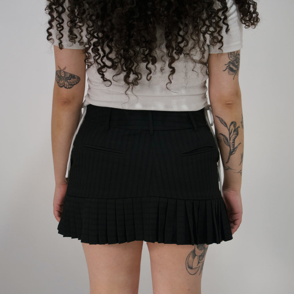 Mini falda negra preppy
