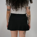 Mini falda negra preppy